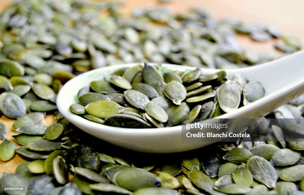 Pumpkin seeds on a spoon