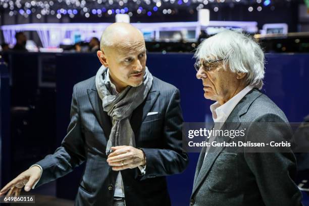 Fabio Filippini of Pininfarina talking to Bernie Ecclestone during the second press day of the Geneva Motor Show 2017 at the Geneva Palexpo on March...