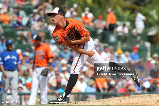 Tyler Wilson of the Orioles delivers a pitch to the plate during the spring training game between the Toronto Blue Jays and the Baltimore Orioles on...