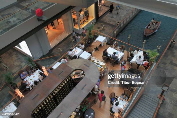 singapore, marina bay sands resort, the shoppes, restaurant, people, - the shoppes stock pictures, royalty-free photos & images