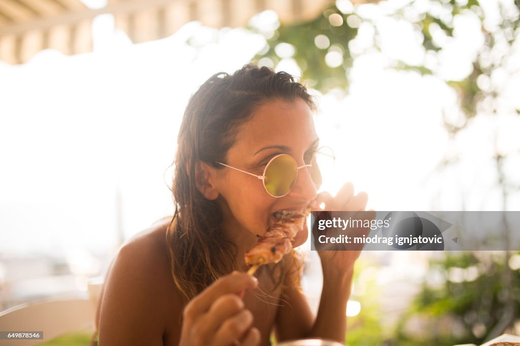Woman Eating with hands