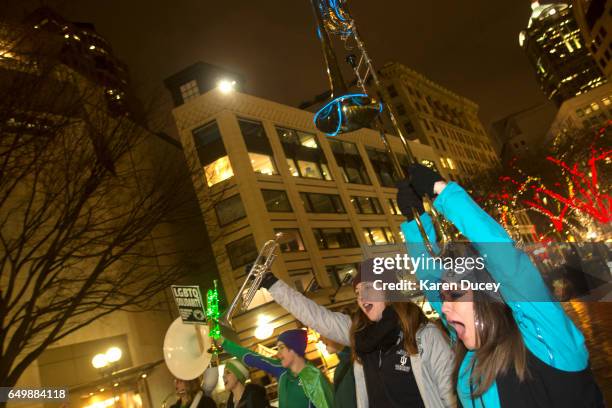 Members of the Filthy Fem Corps perform in honor of International Women's Day at Westlake Center on March 8, 2017 in Seattle, United States. The...