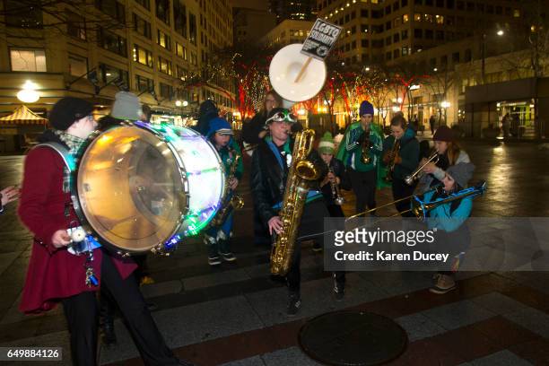 Members of the Filthy Fem Corps perform in honor of International Women's Day at Westlake Center on March 8, 2017 in Seattle, United States. The...