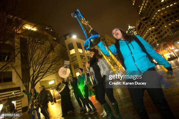 Members of the Filthy Fem Corps perform in honor of International Women's Day at Westlake Center on March 8, 2017 in Seattle, United States. The...