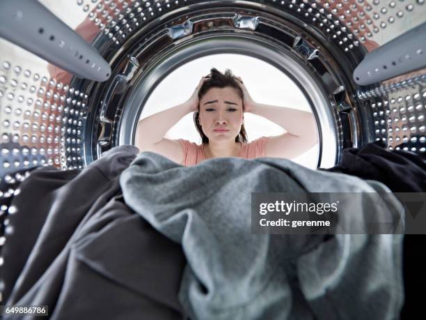 unhappy housewife - lady washing machine stock pictures, royalty-free photos & images