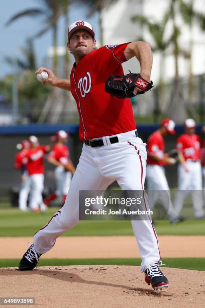 Max Scherzer of the Washington Nationals throws the ball prior to the spring training game against the Boston Red Sox at The Ballpark of the Palm...