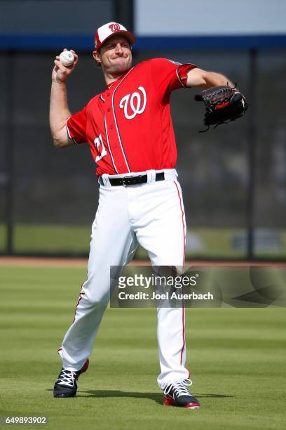 Max Scherzer of the Washington Nationals throws the ball prior to the spring training game against the Boston Red Sox at The Ballpark of the Palm...
