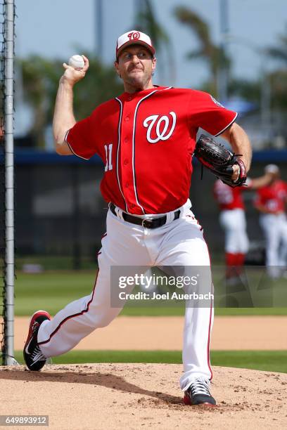 Max Scherzer of the Washington Nationals throws the ball prior to the spring training game against the Boston Red Sox at The Ballpark of the Palm...