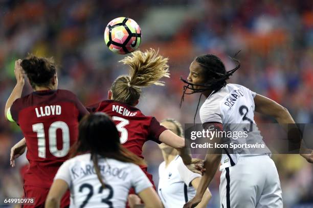 Wendie Renard heads the ball away from Samantha Mewis and Carlie Lloyd . The United States Women's National Team hosted the France Women's National...