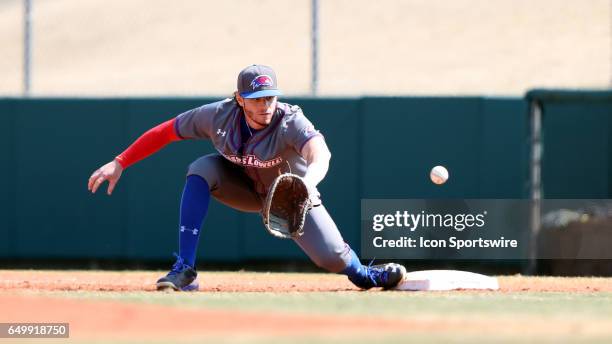 UMass Lowell's Steve Passatempo catches the ball for a put out at first base. The University of Massachusetts Lowell River Hawks played the...