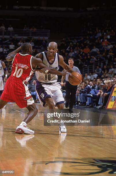 Sam Cassell of the Milwaukee Bucks makes a rush for the basket against Anthony Johnson of the Atlanta Hawks during the game at the Bradley Center in...