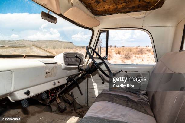 interior of abandoned truck in the desert - vintage car interior stock pictures, royalty-free photos & images