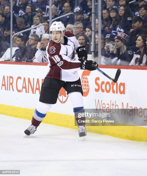 Cody Goloubef of the Colorado Avalanche follows the play around the boards during first period action against the Winnipeg Jets at the MTS Centre on...