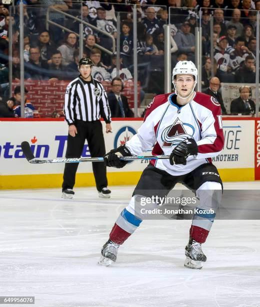 Cody Goloubef of the Colorado Avalanche keeps an eye on the play during third period action against the Winnipeg Jets at the MTS Centre on March 4,...