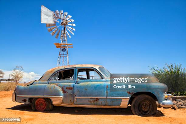abandoned vintage car in the desert - abandoned stock pictures, royalty-free photos & images
