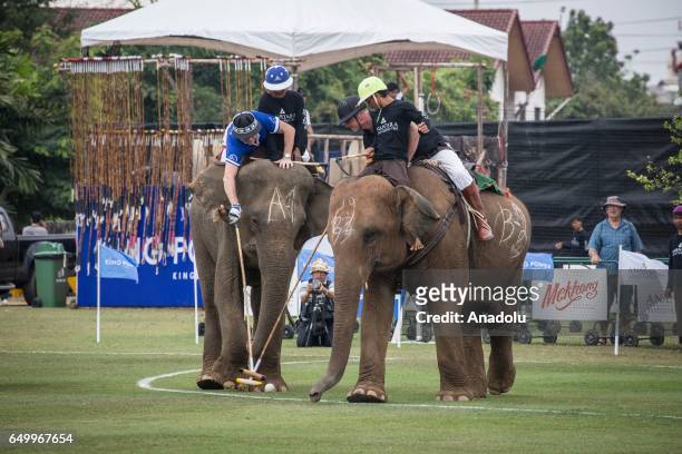 Elephant polo team battle for the ball during a match at the 2017 King's Cup Elephant Polo at Anantara Chaopraya Resort in Bangkok, Thailand on March...