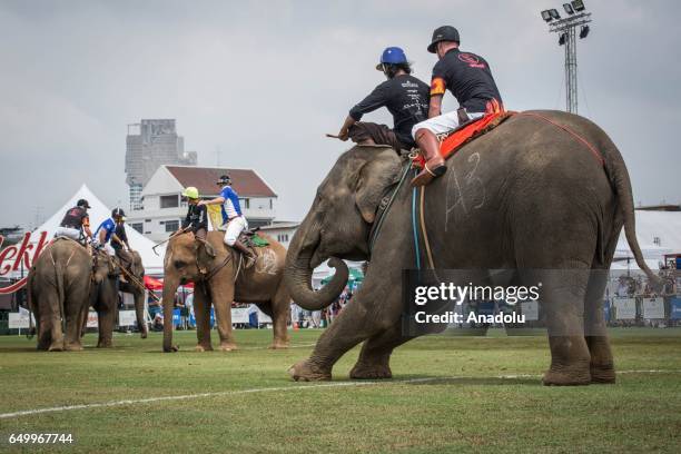 Polo player rides an elephant with a mahout during the 2017 King's Cup Elephant Polo at Anantara Chaopraya Resort in Bangkok, Thailand on March 09,...