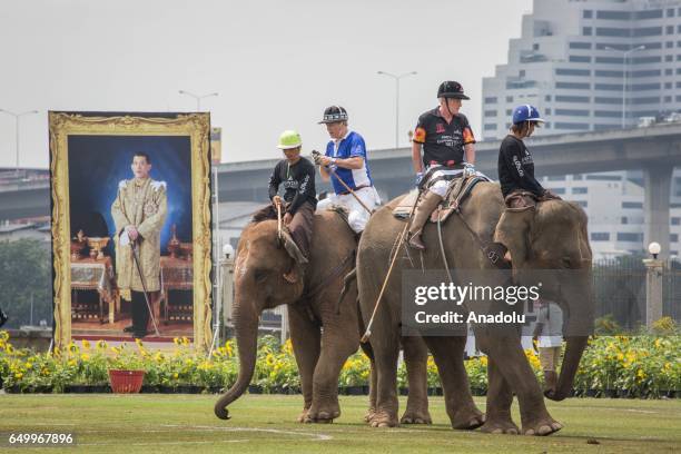 Polo players ride their elephant during the 2017 King's Cup Elephant Polo at Anantara Chaopraya Resort in Bangkok, Thailand on March 09, 2017. The...