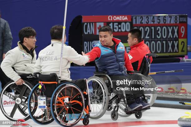 Haitao Wang from China shakes hands with Lee Dong-Ha from South Korea after winning round robin session 12 in the World Wheelchair Curling...