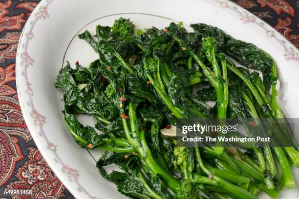 Sautéed Broccoli Rabe on a white oval plate shot on December 20th, 2016 in Washington DC.