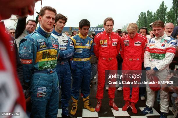 The drivers hold a minutes silence for Simtek driver, Roland Ratzenberger killed during the qualifying session and Williams' driver Ayrton Senna, who...