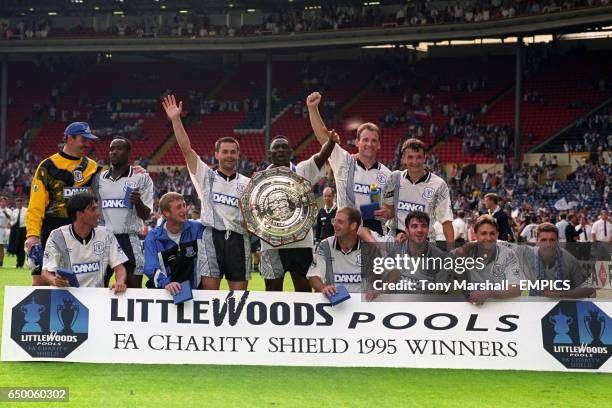 The Everton team celebrate with the Charity Shiled after beating Blackburn Rovers 1-0. Neville Southall, Earl Barrett, Anders Limpar, Daniel...