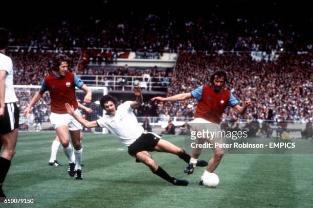 Tommy Taylor and Billy Bonds both West Ham United, Surround John Lacy of Fulham