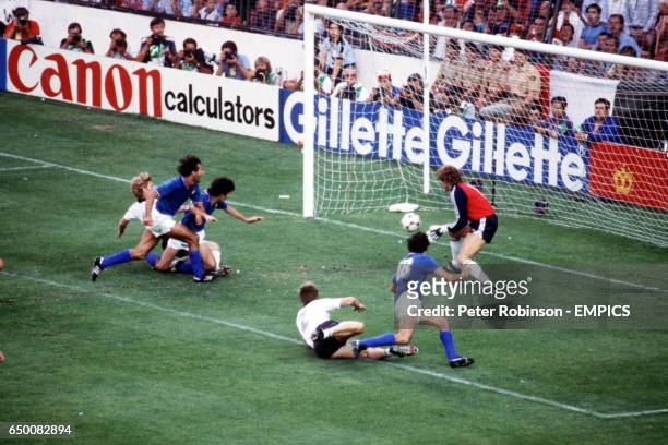 Paolo Rossi slides in to score Italy's first goal