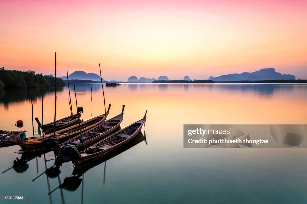 Wooden boats in the sea at sunset, Phuket,Thailand.
