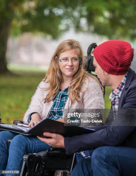 college friends study outdoors together - man talking to camera stock pictures, royalty-free photos & images