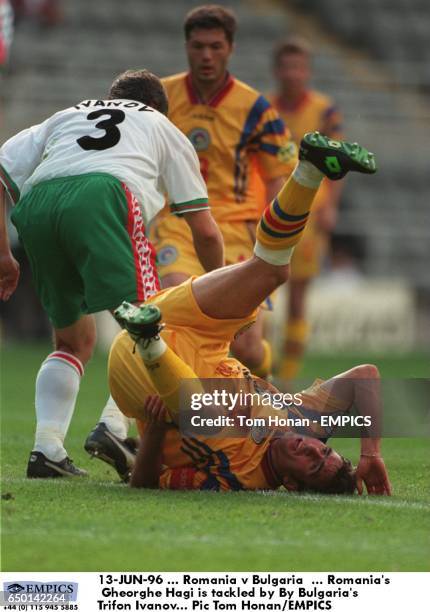 Romania's Gheorghe Hagi is tackled by By Bulgaria's Trifon Ivanov