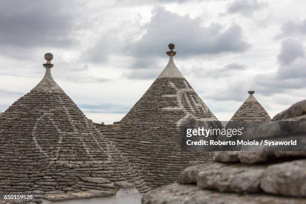 the conical roofs of the trulli alberobello - tufa stock pictures, royalty-free photos & images