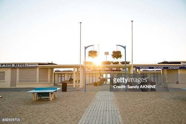 france, normandy, trouville, beach front at sunset - deauville beach stock pictures, royalty-free photos & images