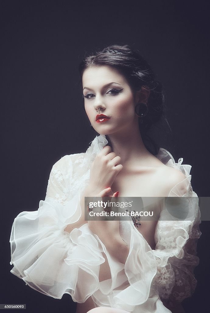 Portrait of a young girl with a lace top with frill Burlesque