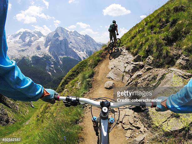 Two men mountain biking, Dolomites, Italy