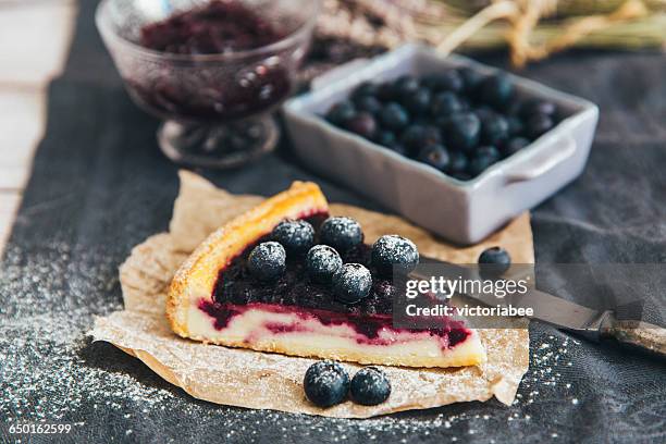 slice of blueberry pie with blueberries and jam - blueberry stock-fotos und bilder