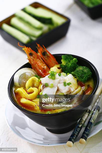 curry udon noodles with seafood - カレーうどん ストックフォトと画像