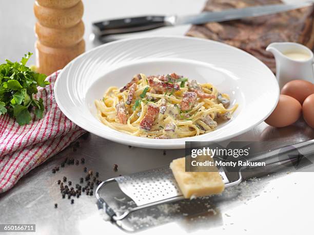traditional italian meal of carbonara - carbonara sauce stock pictures, royalty-free photos & images