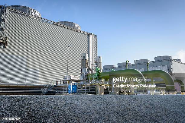 view of cooling towers at gas-fired power station - cooling tower stock pictures, royalty-free photos & images