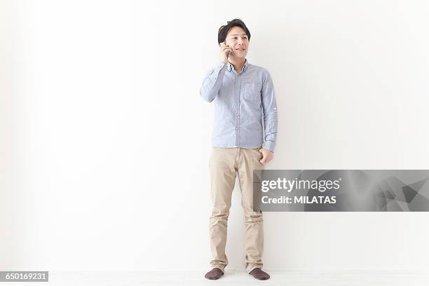 japanese men who call - khaki trousers stockfoto's en -beelden