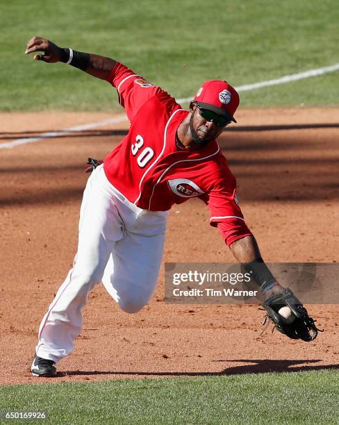 Arismendy Alcantara of the Cincinnati Reds fields a ground ball against the Los Angeles Angels during the spring training game at Goodyear Ballpark...