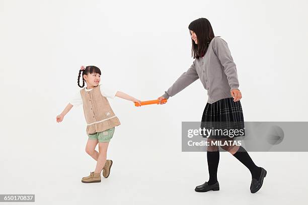 japanese sister to the baton pass - family relay stock pictures, royalty-free photos & images