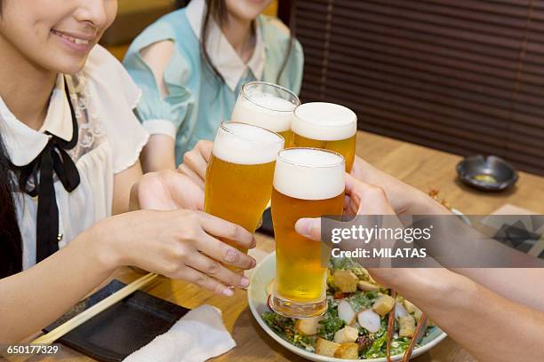 japanese young people who enjoy a drinking party - cup 2015 season launch stock pictures, royalty-free photos & images