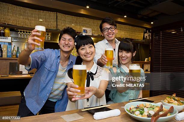 japanese young people who enjoy a drinking party - cup 2015 season launch stock pictures, royalty-free photos & images