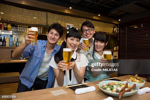 japanese young people who enjoy a drinking party - cup 2015 season launch stock pictures, royalty-free photos & images