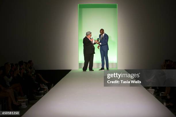 Former NFL player and sportswear designer Terrell Owens receives the Fashion Setters award onstage at the Fashion Setters Gala at the Beverly...