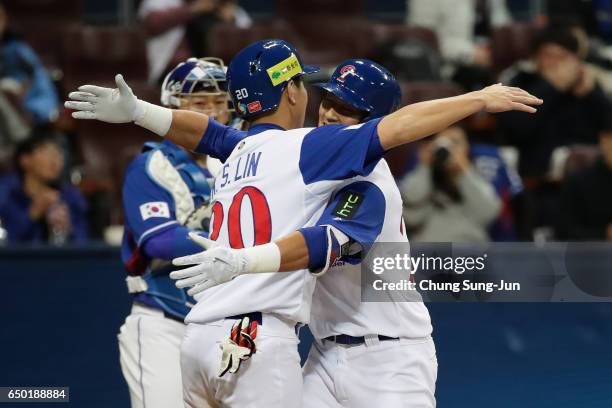 Outfielder Che-Hsuan Lin of Chinese Taipei celebrates with his team mate Catcher Kun-Sheng Lin after hitting a two run homerun to make it 8-5 in the...