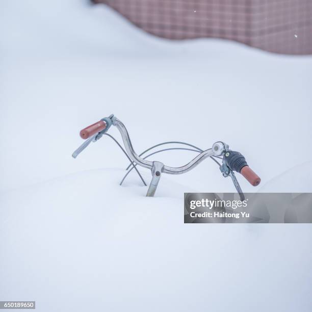 buried bicycle in hokkaido, japan - sapporo stock pictures, royalty-free photos & images
