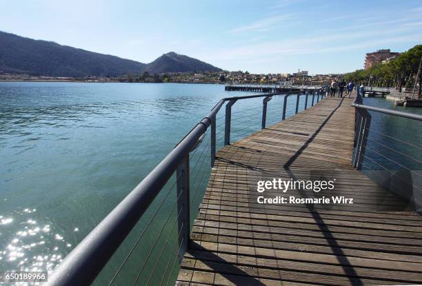 wooden footbridge on lake iseo - sarnico stock pictures, royalty-free photos & images