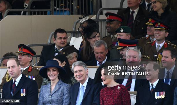 Britain's Prince William, Duke of Cambridge, Britain's Catherine, Duchess of Cambridge, British Chancellor of the Exchequer Philip Hammond, Britain's...